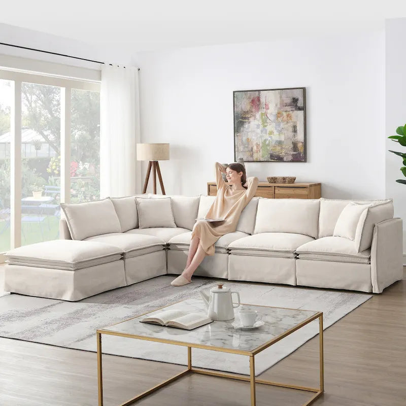 Divano sezionale modulare a L in ciniglia con pouf mobile