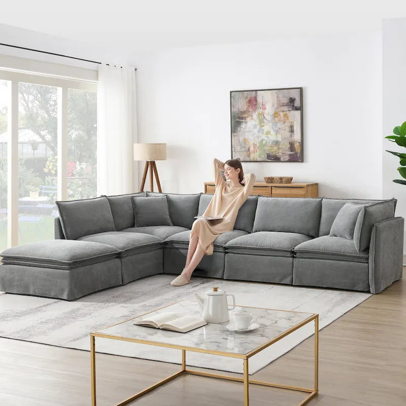 Divano sezionale modulare a L in ciniglia con pouf mobile
